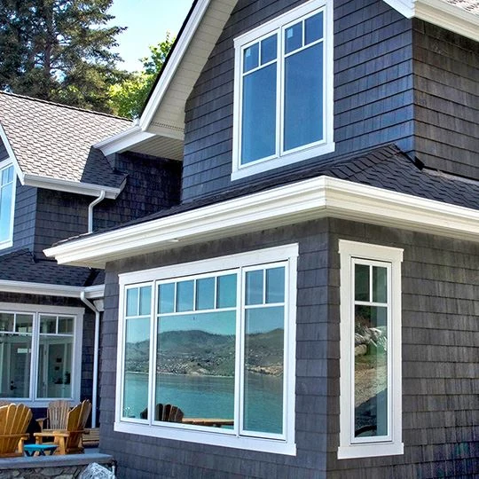 Nichiha Sierra Premium Shake Charcoal siding on a home with white window trim